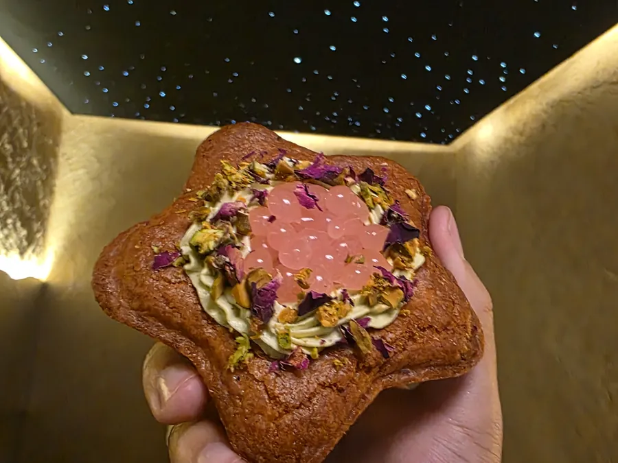Pistachio cookie held in hand