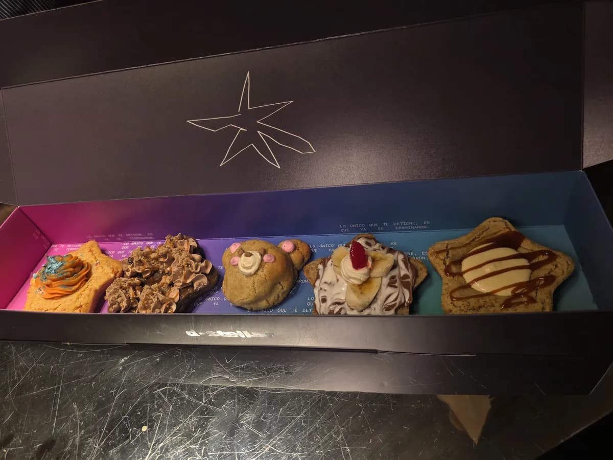 Box with April's five cookies, including Teddy Bear